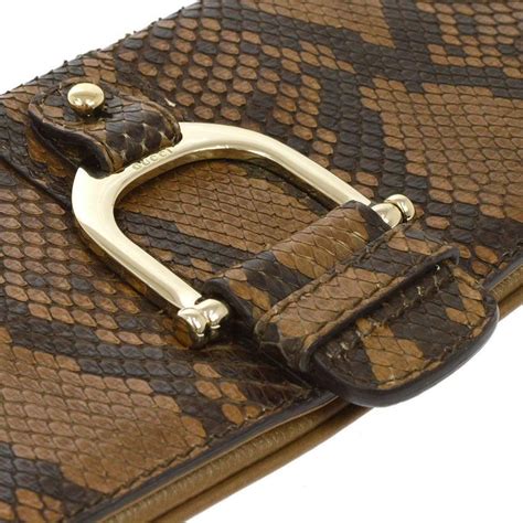 horsebit clutch gucci|Gucci snakeskin clutch.